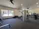 Bright gym with ceiling fans, modern exercise equipment, and mirrored walls at 5260 Mission Monterey Ln # 208, Las Vegas, NV 89107