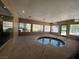 Indoor hot tub with multiple windows, providing a relaxing and bright atmosphere at 5260 Mission Monterey Ln # 208, Las Vegas, NV 89107