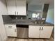 Kitchen with granite countertops, gray subway tile backsplash and stainless steel dishwasher at 5260 Mission Monterey Ln # 208, Las Vegas, NV 89107