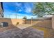 Private backyard with a brick-paved patio and secure brick wall at 5299 Silver Branch Ave, Las Vegas, NV 89118