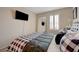 Cozy bedroom with a full-length mirror and a sleek, modern design at 5299 Silver Branch Ave, Las Vegas, NV 89118