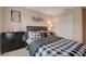 Well-appointed bedroom with decorative wall art and ample closet space at 5299 Silver Branch Ave, Las Vegas, NV 89118