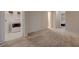 Carpeted bedroom area near washer and dryer hookups with doorway to bedroom at 5299 Silver Branch Ave, Las Vegas, NV 89118