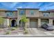 Charming townhouse with a private entrance, well-maintained landscaping, and a driveway at 5299 Silver Branch Ave, Las Vegas, NV 89118