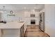 Modern kitchen featuring stainless appliances, a large island, and a dining area at 5299 Silver Branch Ave, Las Vegas, NV 89118