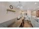 View of dining table from the kitchen, plus living space beyond at 5299 Silver Branch Ave, Las Vegas, NV 89118