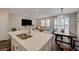 Living space view of kitchen island, dining table, and living room at 5299 Silver Branch Ave, Las Vegas, NV 89118