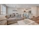Inviting living room showcases a plush sofa, modern kitchen with bar seating, and stylish decor at 5299 Silver Branch Ave, Las Vegas, NV 89118