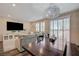 The living room includes a dining table, couch and entertainment center at 5299 Silver Branch Ave, Las Vegas, NV 89118