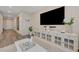 Cozy living room with modern decor, a large television, and bright natural light at 5299 Silver Branch Ave, Las Vegas, NV 89118