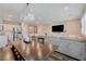 A large living area features an entertainment center, couch and dining table at 5299 Silver Branch Ave, Las Vegas, NV 89118