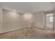 Inviting upstairs loft with neutral paint and carpet, offers a cozy and flexible living space at 5299 Silver Branch Ave, Las Vegas, NV 89118