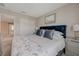 Comfortable primary bedroom with a queen bed, and a stylish mirror over the headboard at 5299 Silver Branch Ave, Las Vegas, NV 89118