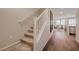 Carpeted staircase leading to the upper level, with hardwood flooring and a contemporary design at 5299 Silver Branch Ave, Las Vegas, NV 89118