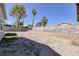 Large gravel backyard with a block wall, providing privacy and ample space at 5535 Oxbow St, Las Vegas, NV 89119
