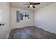 This bedroom includes wood-look flooring and a ceiling fan at 5535 Oxbow St, Las Vegas, NV 89119