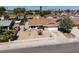 Charming single-story home featuring a well-maintained yard with desert landscaping and a white picket fence at 5535 Oxbow St, Las Vegas, NV 89119