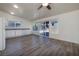 Open kitchen featuring white cabinets, light granite countertops, modern appliances, and lots of natural light at 5535 Oxbow St, Las Vegas, NV 89119