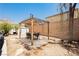 Large backyard features a cozy pergola with a dining area, making it ideal for outdoor entertaining and relaxation at 561 Fork Mesa Ct, Henderson, NV 89015