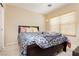 Cozy bedroom featuring carpet, a comfortable queen-size bed, and a bright window at 561 Fork Mesa Ct, Henderson, NV 89015