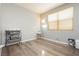 Bedroom with hardwood floors, neutral walls, and a window providing natural light at 561 Fork Mesa Ct, Henderson, NV 89015