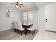 Inviting dining area features neutral wall paint, chandelier, and sleek wood-look floors, great for Gathering meals at 561 Fork Mesa Ct, Henderson, NV 89015