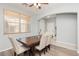 Inviting dining room features neutral wall paint, chandelier, and sleek wood-look floors, great for gatherings at 561 Fork Mesa Ct, Henderson, NV 89015