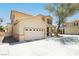 Well-maintained two-story home featuring a desert landscape, large driveway and a welcoming covered front porch at 561 Fork Mesa Ct, Henderson, NV 89015