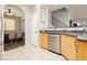 Well-lit kitchen features modern appliances, stone countertops, and open access to the dining room at 561 Fork Mesa Ct, Henderson, NV 89015