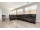 Spacious living room with hardwood floors, recessed lighting, and a large, comfortable sectional sofa at 561 Fork Mesa Ct, Henderson, NV 89015