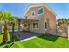 Exterior of home featuring a patio, desert landscaping, and secured yard at 576 Foster Springs Rd, Las Vegas, NV 89148