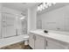 Clean bathroom featuring a shower over bath, single sink vanity, and modern finishes at 576 Foster Springs Rd, Las Vegas, NV 89148