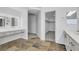 Bathroom featuring dual sink vanity with a walk-in closet at 576 Foster Springs Rd, Las Vegas, NV 89148
