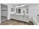 Large bathroom featuring dual sink vanity with soaking tub at 576 Foster Springs Rd, Las Vegas, NV 89148