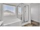 Relaxing soaking tub and modern glass shower at 576 Foster Springs Rd, Las Vegas, NV 89148