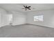 Spacious primary bedroom featuring neutral carpeting and vaulted ceilings at 576 Foster Springs Rd, Las Vegas, NV 89148