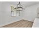 Charming dining nook with stylish chandelier and plenty of natural light at 576 Foster Springs Rd, Las Vegas, NV 89148