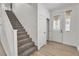 Bright foyer with stairwell and light wood flooring at 576 Foster Springs Rd, Las Vegas, NV 89148