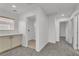 Bright hallway with a built-in cabinet and access to the laundry room at 576 Foster Springs Rd, Las Vegas, NV 89148