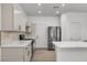 Well-appointed kitchen with stainless steel appliances, modern cabinetry, and quartz countertops at 576 Foster Springs Rd, Las Vegas, NV 89148