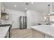 Contemporary kitchen with stainless steel appliances and a center island with quartz countertops at 576 Foster Springs Rd, Las Vegas, NV 89148