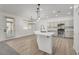 Modern kitchen with center island, stainless steel appliances, and sleek countertops at 576 Foster Springs Rd, Las Vegas, NV 89148
