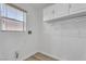 Bright laundry room with cabinets for extra storage at 576 Foster Springs Rd, Las Vegas, NV 89148