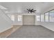 Bright, open living room features modern decor and large windows with blinds at 576 Foster Springs Rd, Las Vegas, NV 89148