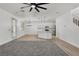 Open concept living room with ceiling fan and backyard access at 576 Foster Springs Rd, Las Vegas, NV 89148