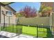 Backyard putting green area with artificial grass and minimal landscaping at 576 Foster Springs Rd, Las Vegas, NV 89148