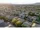 Extensive aerial shot exhibits a residential area with diverse housing and mature trees at 5823 Falling Stream Ave, Las Vegas, NV 89131