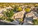 Expansive aerial view of a residential neighborhood with lush greenery and well-maintained homes at 5823 Falling Stream Ave, Las Vegas, NV 89131