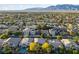 Sweeping aerial photograph captures a community nestled amidst the mountains at 5823 Falling Stream Ave, Las Vegas, NV 89131