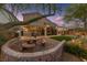 Charming backyard patio featuring a custom stone table set and covered entertaining space at 5823 Falling Stream Ave, Las Vegas, NV 89131